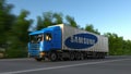 Freight semi truck with Samsung logo driving along forest road. Editorial 3D rendering