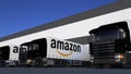 Freight semi trucks with Amazon.com logo loading or unloading at warehouse dock, seamless loop. Editorial animation