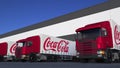 Freight semi trucks with Coca-Cola logo loading or unloading at warehouse dock. Editorial 3D rendering