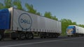 Freight semi trucks with Dell Inc. logo driving along forest road. Editorial 3D rendering