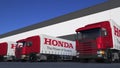 Freight semi trucks with Honda logo loading or unloading at warehouse dock. Editorial 3D rendering