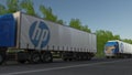 Freight semi trucks with HP Inc. logo driving along forest road. Editorial 3D rendering