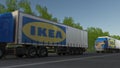 Freight semi trucks with Ikea logo driving along forest road. Editorial 3D rendering