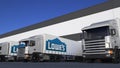 Freight semi trucks with Lowe`s logo loading or unloading at warehouse dock, seamless loop. Editorial animation