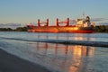 The freight ship Kumpula by ESL Shipping in scenic evening sunlight on the river Weser