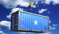 Somalia - freight shipping container with national flag on crane hook