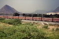 Freight train on background of picturesque Indian countryside