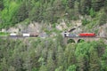 Freight train goes from Chur to St. Moritz. Royalty Free Stock Photo