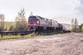 Freight train hauled by the diesel locomotives passing the forest Royalty Free Stock Photo