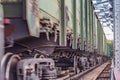 Freight train moves through the railway bridge Royalty Free Stock Photo