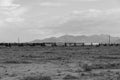 Freight train moving through desert landscape of Mojave Desert Royalty Free Stock Photo