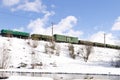 Freight train moving by railways in winter Royalty Free Stock Photo