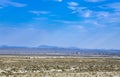 Freight train passes lowlands near Ridgecrest Royalty Free Stock Photo