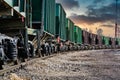 The freight train passes by the station. Wagons with goods delivery Royalty Free Stock Photo