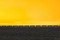 Freight train passing on on the horizon of field in the American countryside. Sunset light and the stormy sky Royalty Free Stock Photo