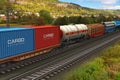 Freight train passing by mountain range Royalty Free Stock Photo