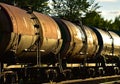 Freight train with petroleum tank cars on railroad. Rail cars carry oil and ethanol. Railway logistics explosive cargo. Royalty Free Stock Photo