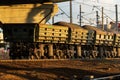 Freight train on rails. Wagons with delivery of ore, crushed stone, coal by railway Royalty Free Stock Photo