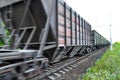 Freight train, railway wagons with motion blur effect. Transportation, railroad. Royalty Free Stock Photo