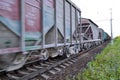 Freight train, railway wagons with motion blur effect. Transportation, railroad. Royalty Free Stock Photo