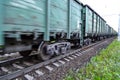 Freight train, railway wagons with motion blur effect. Transportation, railroad. Royalty Free Stock Photo