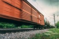 Freight train, railway wagons with motion blur effect. Transportation, railroad Royalty Free Stock Photo