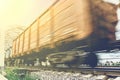 Freight train, railway wagons with motion blur effect. Transportation, railroad Royalty Free Stock Photo