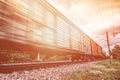 Freight train, railway wagons with motion blur effect. Transportation, railroad Royalty Free Stock Photo