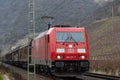 A freight train with a red electric locomotive Royalty Free Stock Photo