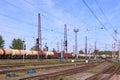 Freight train with tanks moves on rusty railway