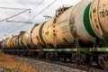 A freight train of tanks rushing by rail. Text in Russian: Transneft, oil transport, gasoline Royalty Free Stock Photo