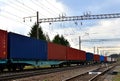 Freight train, transportation of railway cars by cargo containers shipping.