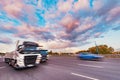 Freight truck moves fast on the highway Royalty Free Stock Photo