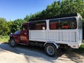 Cuban passenger transport truck parked on a secondary road