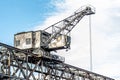 A freight yard crane unloading ship containers