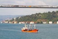 Freighter cruising under the bridge