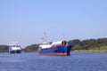 Freighter and feeder ship on Kiel Canal Royalty Free Stock Photo