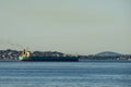 Freighter leaving port to head out to sea in the Strait of Juan de Fuca