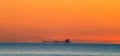 Freighter sailing at dawn