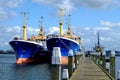 Freighters at pier in Netherlands by blue sky Royalty Free Stock Photo