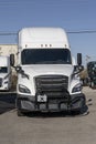 Freightliner Semi Tractor Trailer Big Rig Trucks lined up for sale. Freightliner is owned by Daimler Trucks