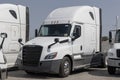 Freightliner Semi Tractor Trailer Trucks lined up for sale. Freightliner is owned by Daimler Trucks