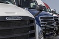 Freightliner Semi Tractor Trailer Trucks lined up for sale. Freightliner is owned by Daimler Trucks