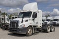 Freightliner Semi Tractor Trailer Trucks Lined up for sale. Freightliner is owned by Daimler