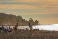 Freinds playing beach volleyball having fun in sporty active life. Young people playing volleyball on beach at sunset