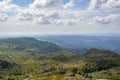 Freita mountain range highland. Rocky landscape with clouds. Hills with yellow and green vegetation