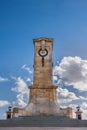 Fremantle, Australia - November 25. 2009: Flanders side of brown-beige tower at war memorial under blue sky with white clouds