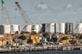 Fremantle, Australia - November 25. 2009: New dock under construction at the port. Many white petroleum tanks as background under