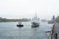 FREMM Languedoc & Svitzer Cartier tugboat Royalty Free Stock Photo