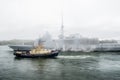 FREMM Languedoc & Svitzer Cartier tugboat Royalty Free Stock Photo